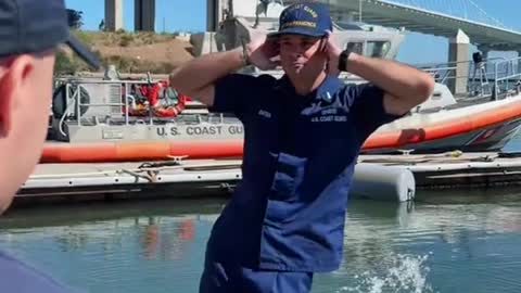 Coast Guard Officers dodging Enlisted cleaning the small boats.