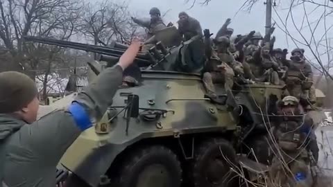 Ukrops performing the Nazi salute while riding freshly shipped Western vehicles