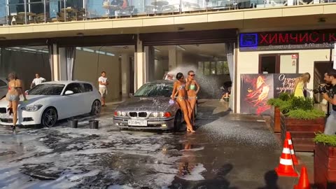 Using attractive girls to wash cars to attract customers and better and more profitable advertising