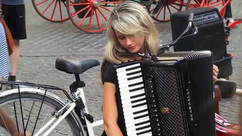 Beautiful Blonde Girl Playing Accordion in Rome