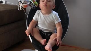 Baby Jax Struggles to Stay Awake in Rocker