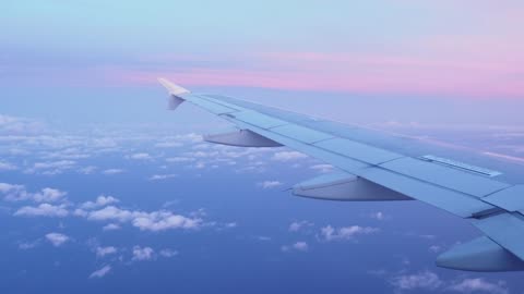 Pink sunset seen from a plane window