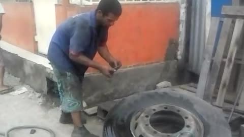 Man Inflates Tire with Fire and Pants Fall Down