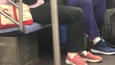 "a new york valentine" woman gives foot massage to her girlfriend on subway train