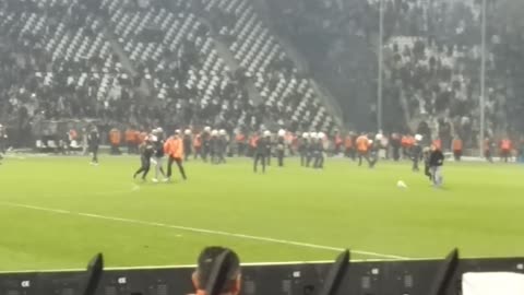 Fans clash with police during rival soccer match