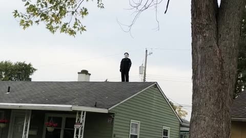 Michael Myers Decoration On Neighborhood Roof