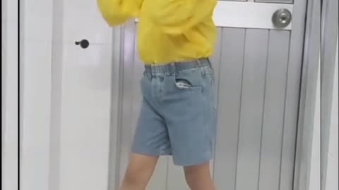 Little girl passionately practicing dancing as instructed on the phone