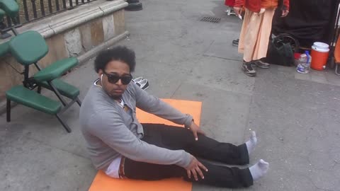 Luodong Massages Black Man With Afro On Sidewalk