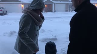 Toddler makes parents dive into the snow