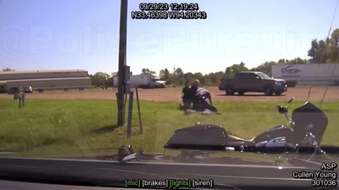 Troopers pit a Harley-Davidson, rider sent flying through the air.