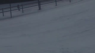 Guy in red jacket can't land a front flip on skis