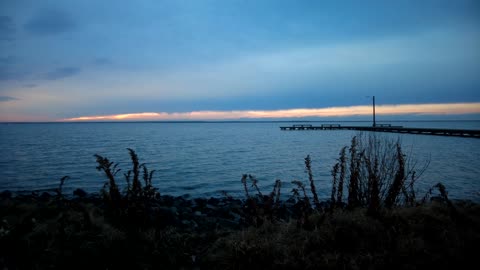 Cloudy Sky Explodes With Sunlight Over Bay