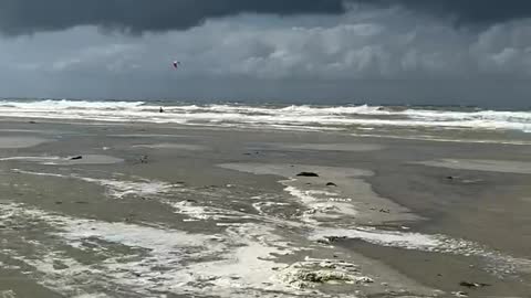 Insane jump of kite surfer.