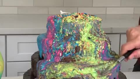When the colors dump down the chocolate cake perfectly…