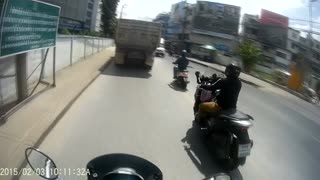 Motorcyclist Narrowly Avoids Oncoming Car