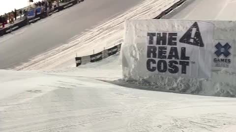 Snowboarder Slides Over Giant Jump