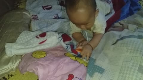 The baby practices a suckling milk.