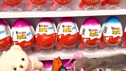 Monkey Baby Bon Bon doing shopping in Kinder Joy Egg store and eat chocolate with puppy