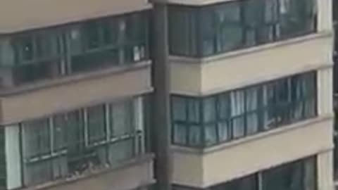 Shocking! Children playing on the top of a building