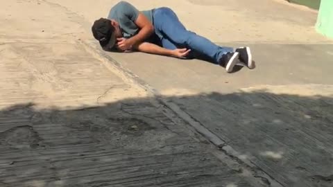 Skater runs onto skateboard and falls