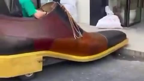 IN CHINA A SHOE SALESMAN BUILD A SHOE SHAPED CAR TO PROMOTE HIS STORE