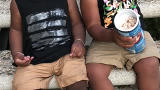 Babies sharing snacks