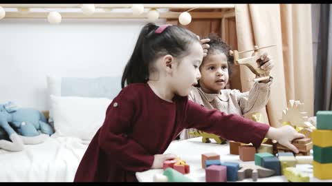 kids-playing-with-wooden-toy-machines