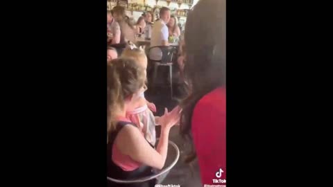 15 month old baby is forced by her mother to tip drag strippers at a bar