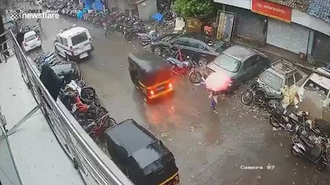 Woman dodges falling tree during cyclone