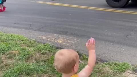 Baby boy greets big sister as she gets off the school bus