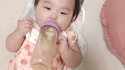 cute baby drinking milk