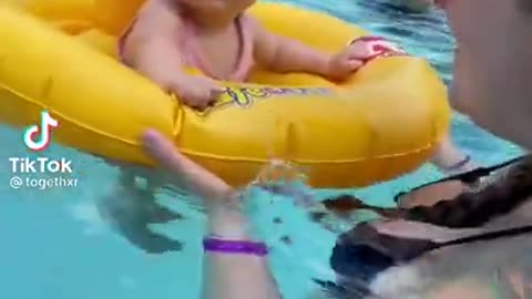 Cuite baby dancing in the pool