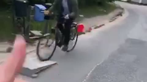 Guy in green falls off his bike while going over ramp