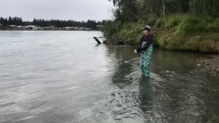 Landing a Kenai river red salmon.