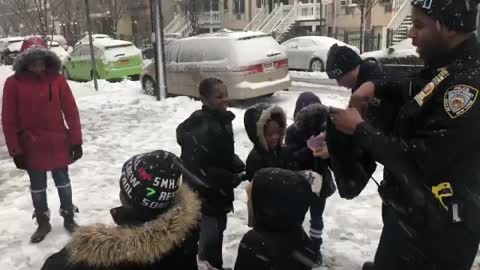 Snowball Fight Between NYPD Officers And Kids