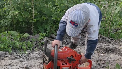 Little Man Frustrated About His Broken Chainsaw