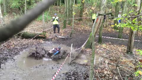 Cyclocross competitor takes break from race - Cannonballs into mud bath!