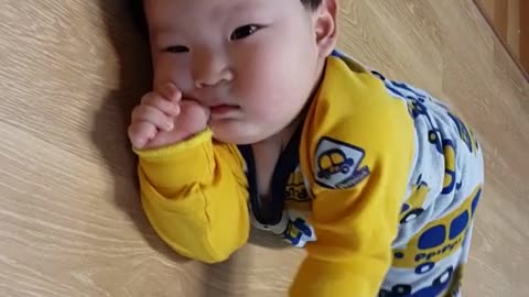 Baby trying to crawl.