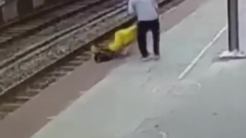 Women saved on railway track.