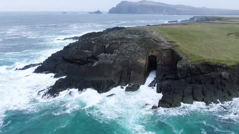 Water Waves Crashing On Rocks In The Middle Of The Sea