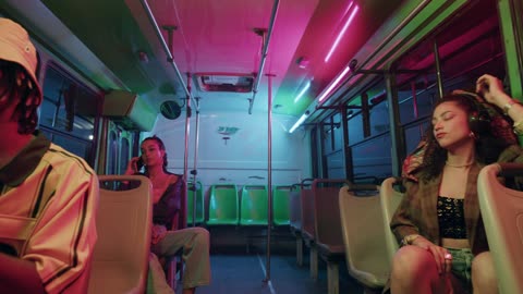 Interior of a bus with a few young passengers