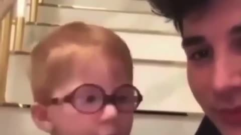 Kid teaches dad how to take tea