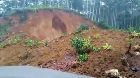 Man on Scooter gets buried alive by a sudden Landslide caught on CCTV