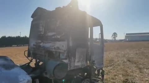 The burnt shells of trucks on the N3