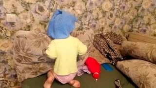 Funny baby wants to dress fashionable.