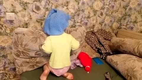 Funny baby wants to dress fashionable.