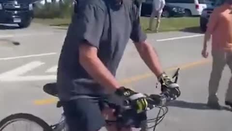 Biden falls off his bike after trying to dismount!