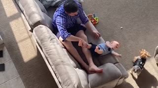 Dad Saves Baby From Tumbling Off the Couch