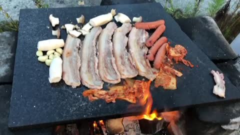 Grilled pork belly on a stone plate