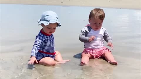 Happy Play Babies in Blue Sea Water